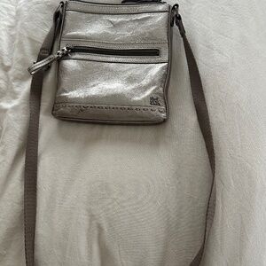 The Sak gold crossbody bag